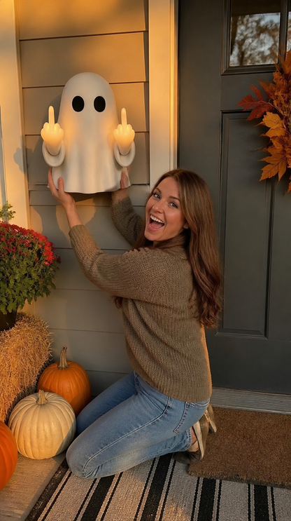 Woman excitedly mounting Boo Ghost night light on Halloween porch